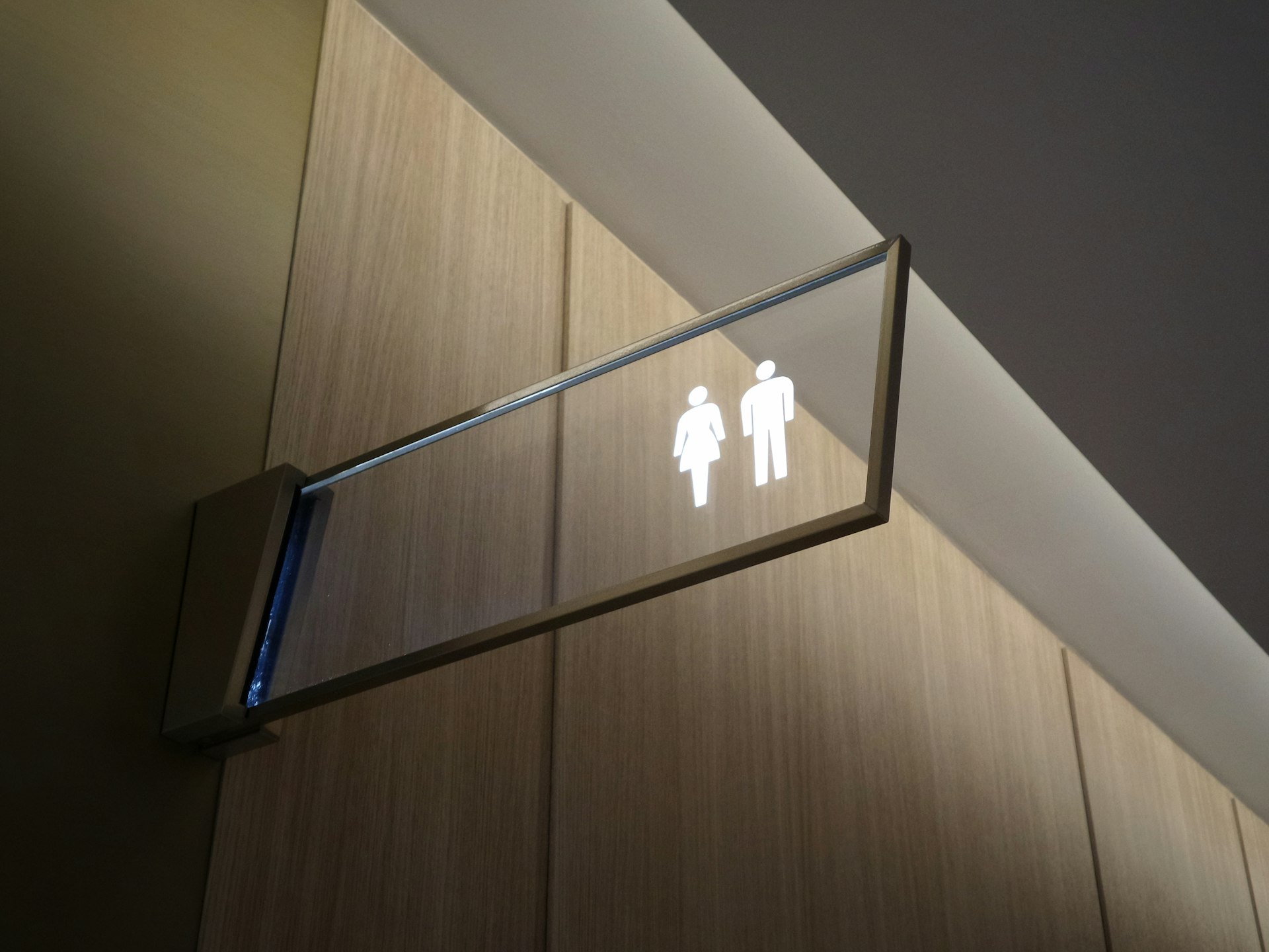 Indicates men's and women's restrooms. Restroom sign for men and women